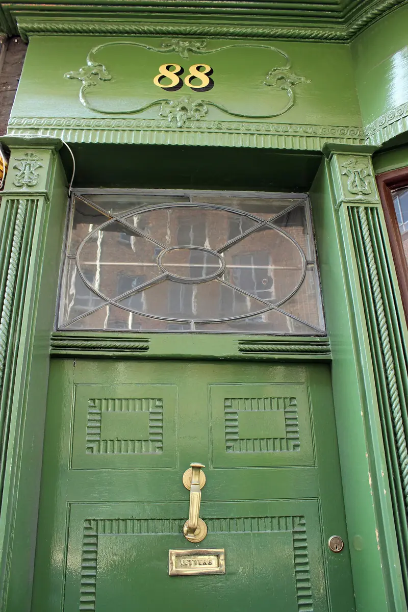 A green Georgian front door numbered 88
