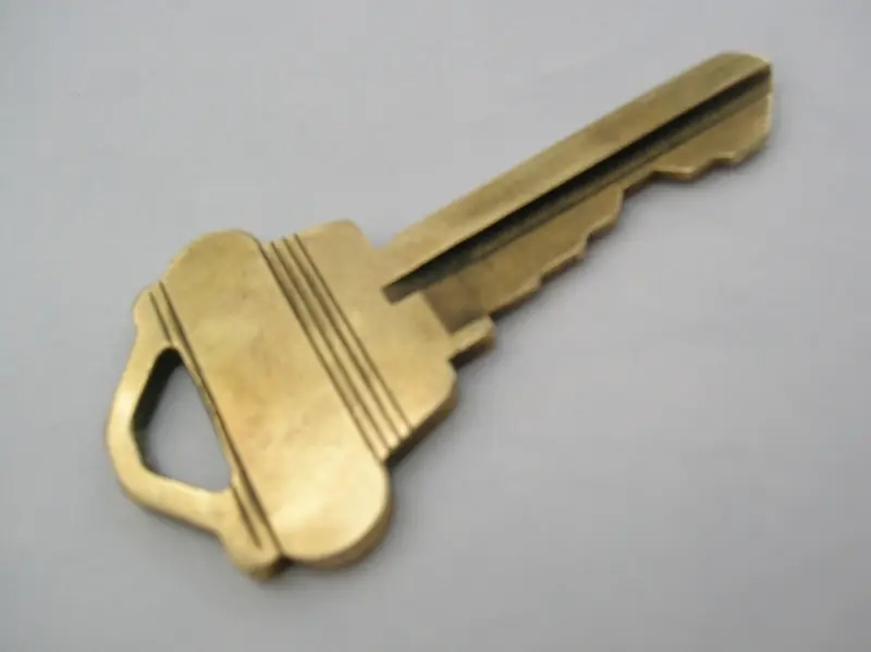 A brass house key